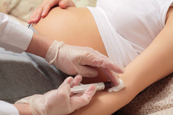 hands of the doctor with syringe, pregnancy, control blood in a laboratory