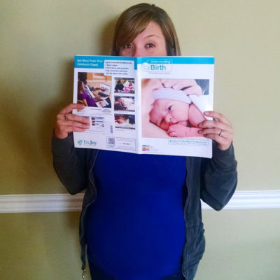 pregnant woman holding magazine