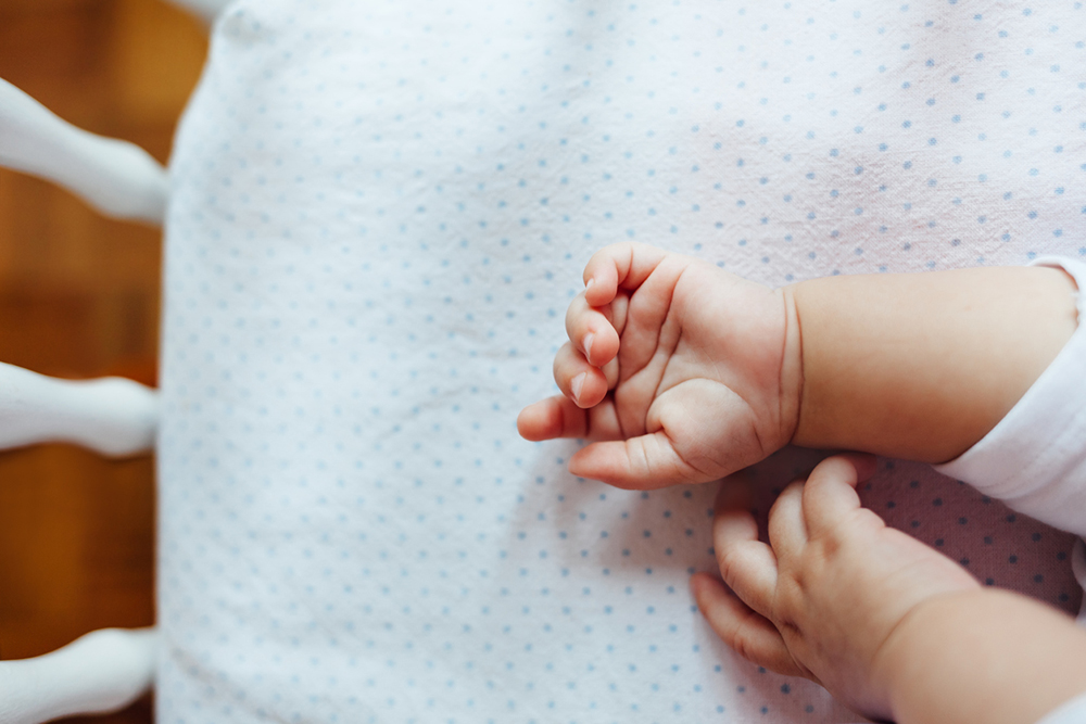 Baby girl sleeping in his bed