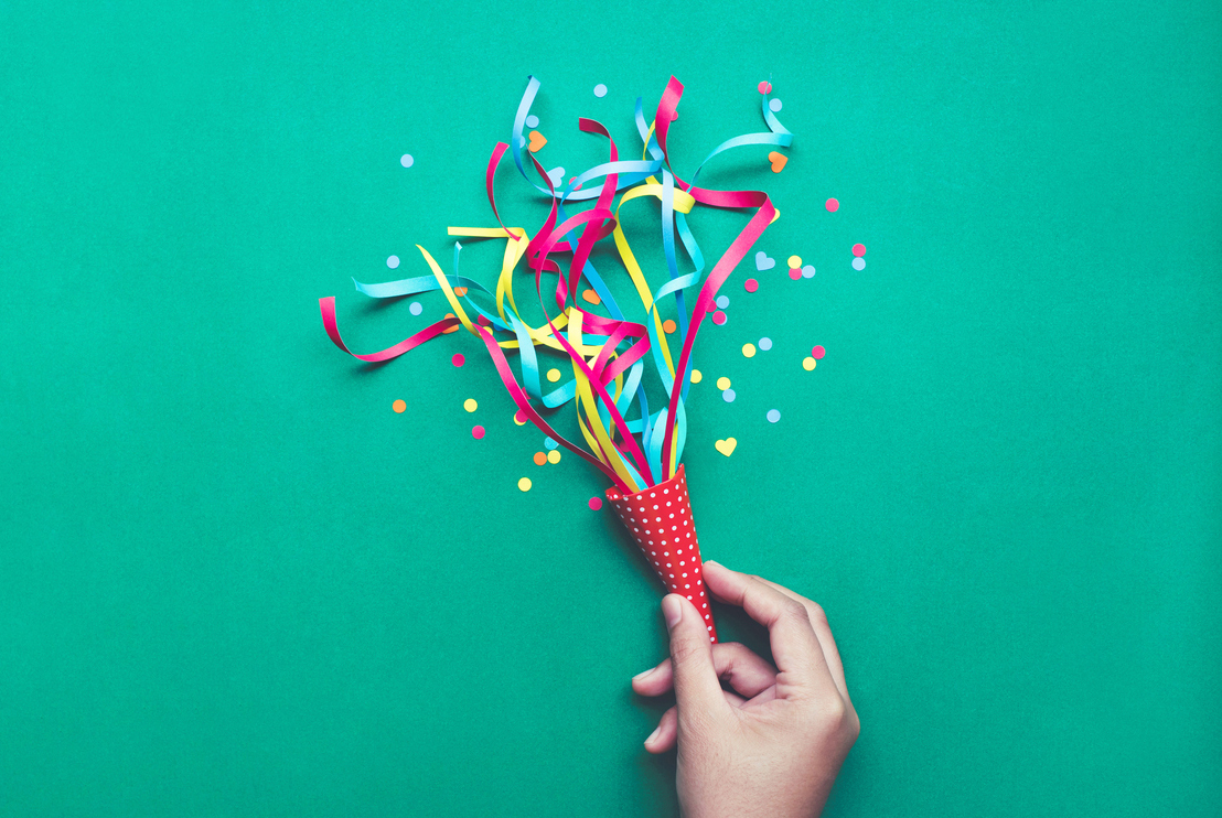 Celebration,party concepts.hand holding colorful confetti,streamers.